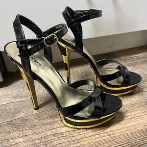 Bebe gold & black patent leather heels - size 9